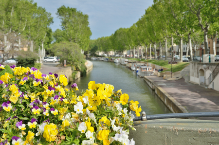 Ancient canal de la Robin runs through the center of the French city Narbonne.の写真素材