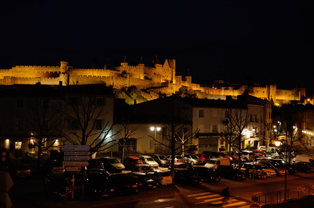 The medieval fortified town is situated above the modern streets in the French city Carcassonne.の写真素材