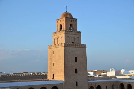 Square minaret of the Great Mosque in the Tunisian town Kairouan or Kairwanの写真素材