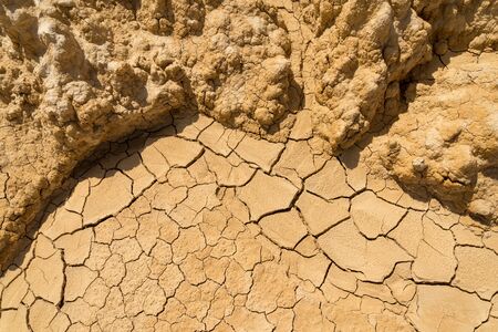 Clay sandy earth parched and cracked