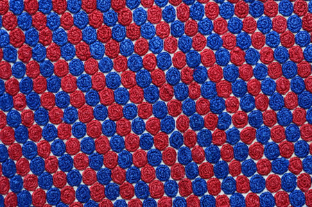 Home made embroidered with red threads canvas with home-woven fabric background