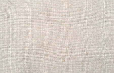 Home made embroidered with red threads canvas with home-woven fabric backgroundの写真素材