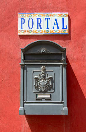 Old-fashioned wooden postbox on the wall Tudela, Spainの写真素材