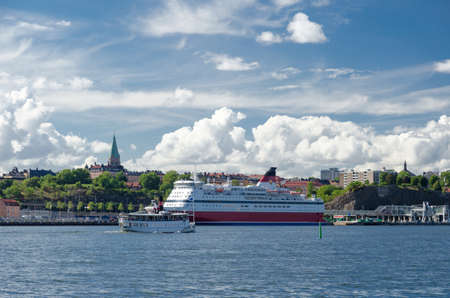 Big passenger liner ship in harbor Djurgarden Stockholm Sweden summer day blue skyの写真素材