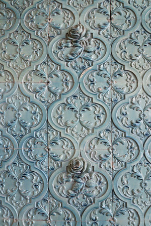Background of blue ceramic tiles with decorative rose flowersの写真素材