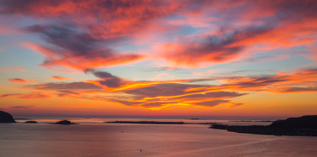 Beautiful red sunset over the sea in Norwayの写真素材