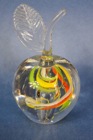 Creative glass transparent apple on a lilac backgroundの写真素材