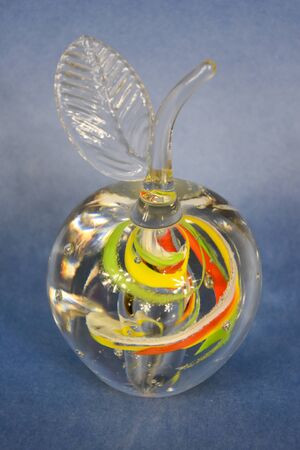 Creative glass transparent apple on a lilac backgroundの写真素材