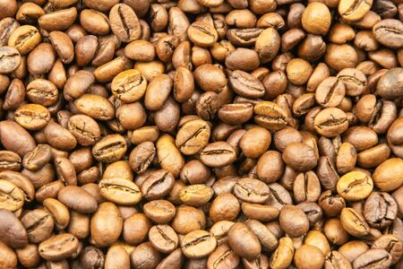 Roasted coffee beans close-up for background