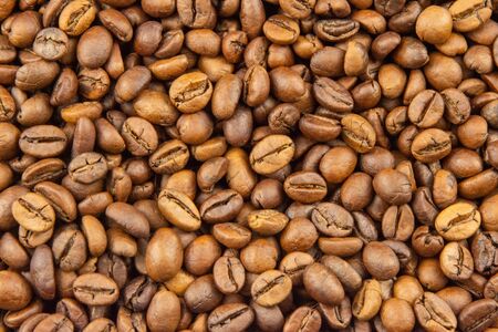 Roasted coffee beans close-up for backgroundの写真素材