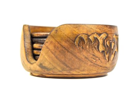 carved wooden coasters for beer mugs or tea isolated on white backgroundの写真素材