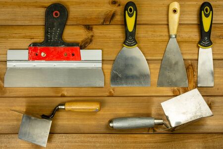 Set of house painter tools on wooden background, top view, flat lay.の写真素材