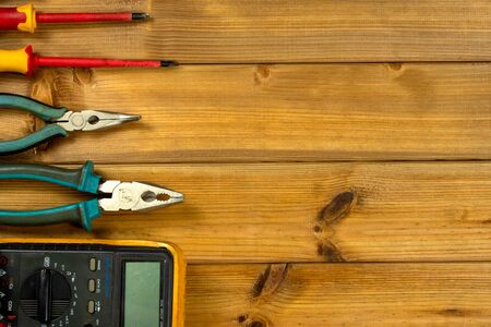 Electrician tool on wooden background with copy space. Top view. Flat layの写真素材