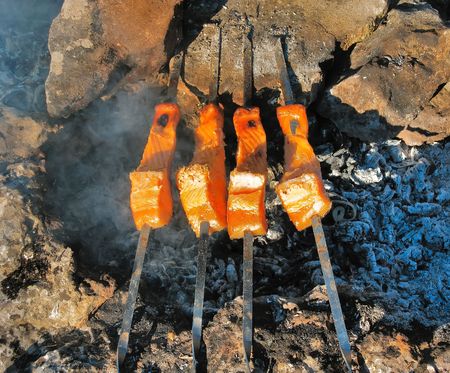 Pieces of sea trout baked on coalsの写真素材