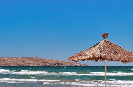Sunshade on the beach near Cape Kazantip in Crimeaの写真素材