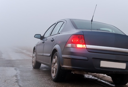 The car on a foggy road in the mountains of the Crimea, Ukraine