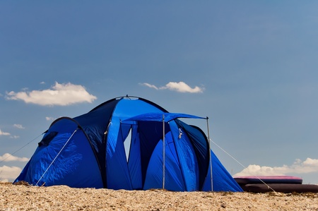 Blue tourist tent on the shore of the Black Sea in Crimea, Ukraine
