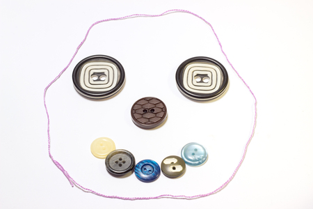 arrangement of buttons on a white background,they are different in color and design,sewing industryの写真素材