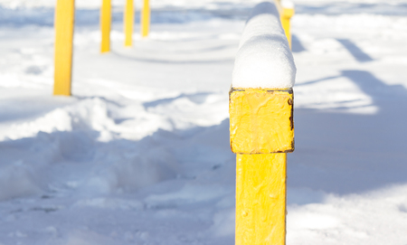 come winter sports equipment and metal structures covered with white and fluffy snowの写真素材