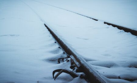 cold winter view of the railroad tracks, a very beautiful snow fallsの写真素材