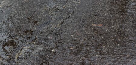 thaw in the winter when the ice begins to melt and the roads begins to flow waterの写真素材