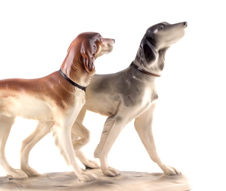 old figurine isolated on a white background, two dogsの写真素材