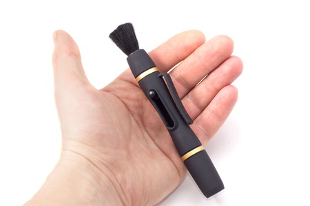 a very useful thing, and very comfortable, there is a special suction cup to the lens and brush to remove dust from the surfaceの写真素材