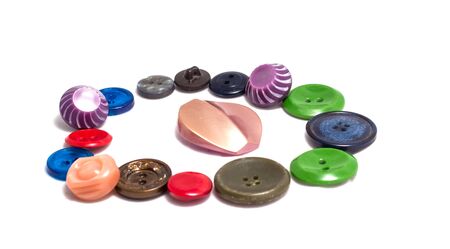 various buttons, one in the center, the rest lined around, bright beautiful and interesting