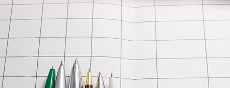 Pen lying on a paper lined with a sheet of paper