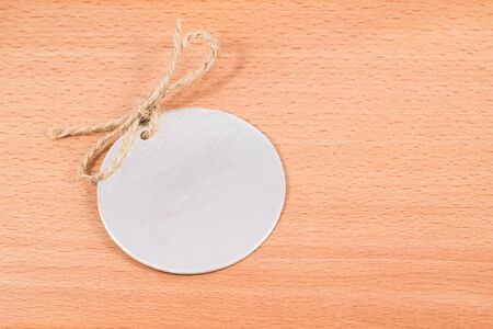 tag for clothes on a wooden background, please enter your brandの写真素材