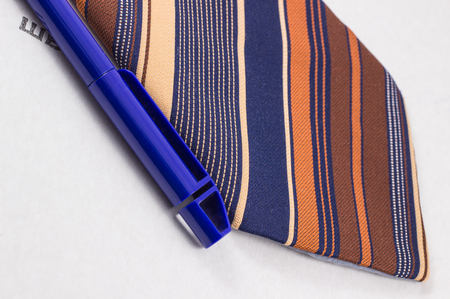 tie and pen on background gray folder for documents, business styleの写真素材