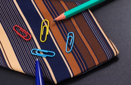 tie on a background of folders for documents, it is business styleの写真素材