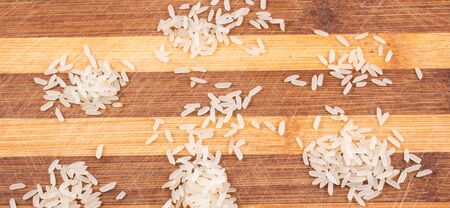 rice cereals in bulk on a wooden background, healthy foodの写真素材