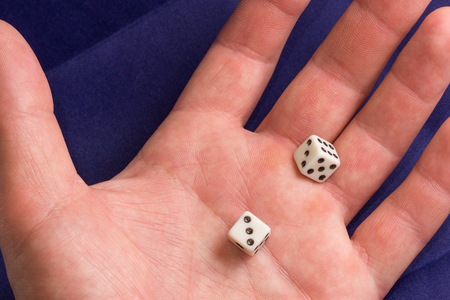dice in the palm, this small dice for board gamesの写真素材