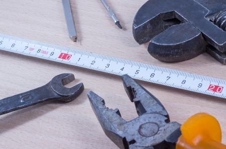 wrench on a wooden background, tool for loosening nuts and bolts
