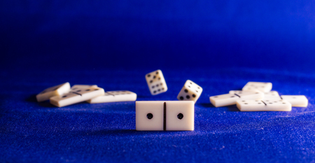 dominoes on the background of the fabric is very popular all over the world board game, its purpose...