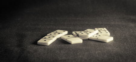 dominoes on the background of the fabric is very popular all over the world board game, its purpose to the hands of the player there is not one diceの写真素材