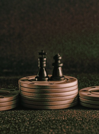 chess and poker chips on a background of the tissue, it is the popular items in the world of board...
