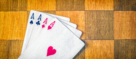 Four aces on the chessboard is a very strong combination of playing cards in poker, practically winning in your pocketの写真素材