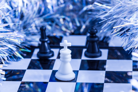 chess and christmas fluffy decoration around the playing board bright and beautifulの写真素材