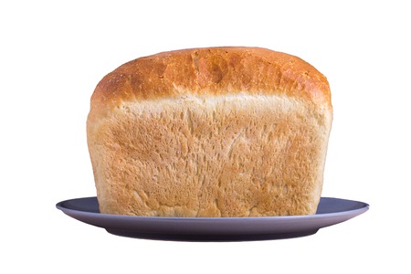 bright loaf of bread lying on a plate on a white background appetizing casual food