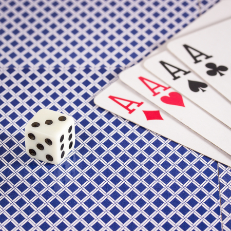 Dice and a strong combination of four aces objects for popular table games all over the worldの写真素材