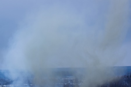 smoke from an exploding shell closes a beautiful view of the concept of warの写真素材