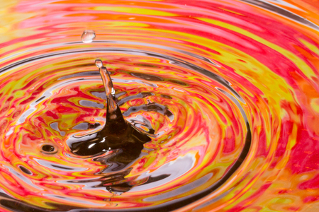 drop on the autumnal water surface closeup an exciting abstraction of a beautiful seasonの写真素材