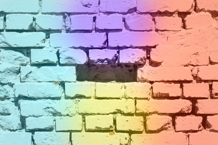 The brick wall for the design is decorated in four bright colors very beautifullyの写真素材