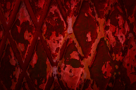 mysterious metal texture with peeled paint and patterns in the form of a diamond grunge background for designの写真素材