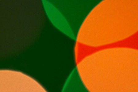 Artistic background for design blurred multicolored lights close-up concept of winter holidaysの写真素材