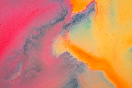 pink yellow abstraction of watercolors in autumn colors background for designの写真素材