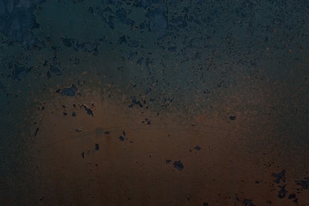 a multi-colored mysterious texture of a metal surface covered with an old partially torn paint...