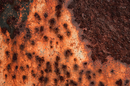 texture of old metal covered with rust and a thin layer of crumbling paint industrial background for...